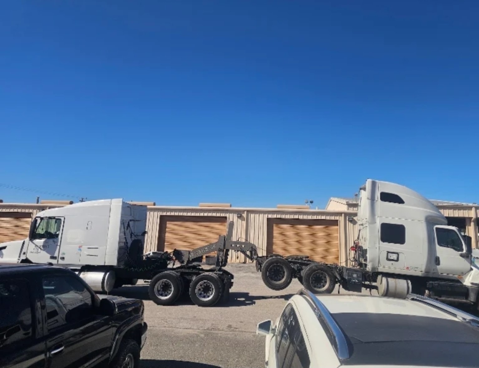 Pro-Tote tow boom connecting two semi tractors